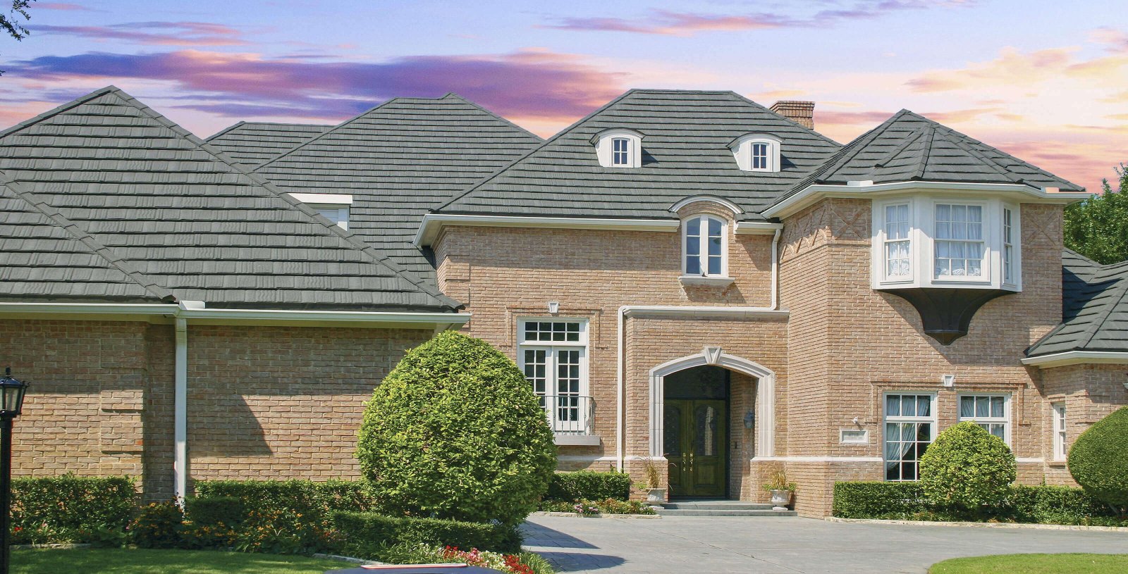 DECRA Shake stone-coated steel roof in Granite Grey on a brick home