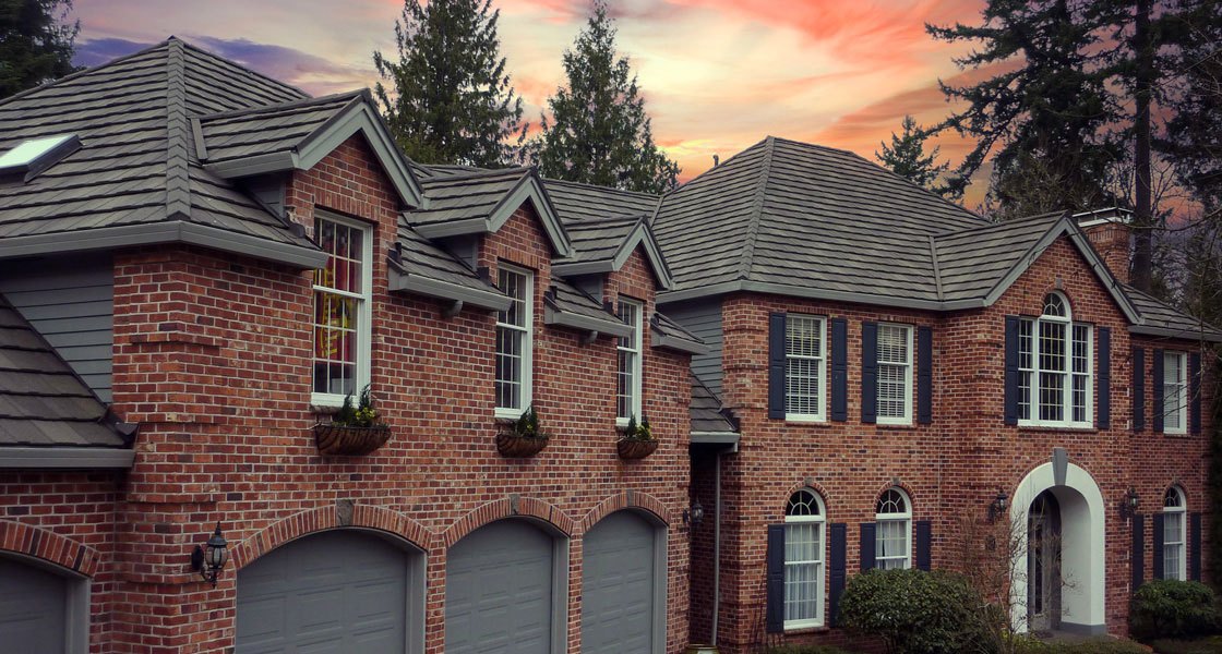 DECRA Shake XD in Pinnacle Grey on a brick home