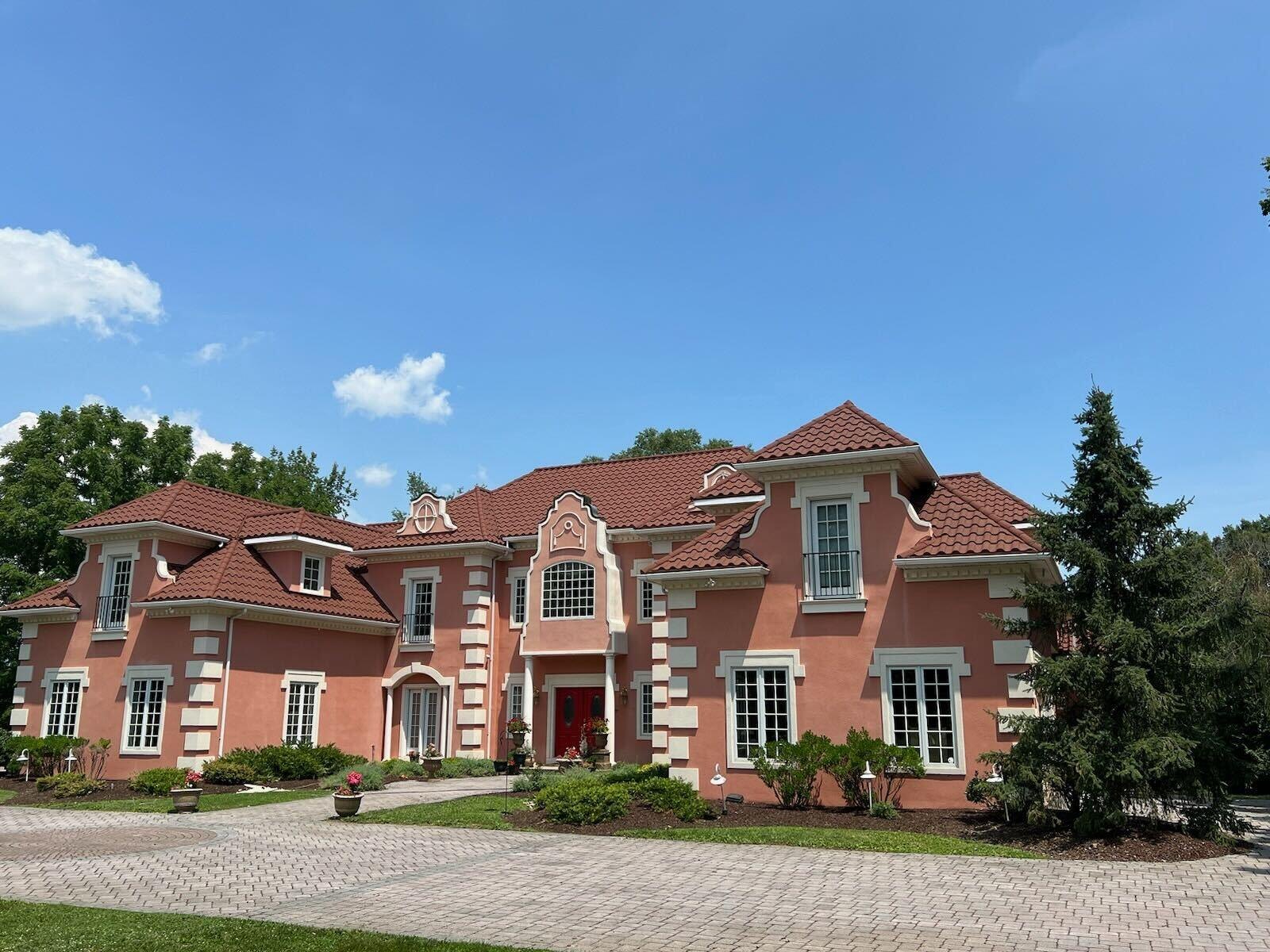 DECRA Villa Tile in Capri Clay on a large brick home