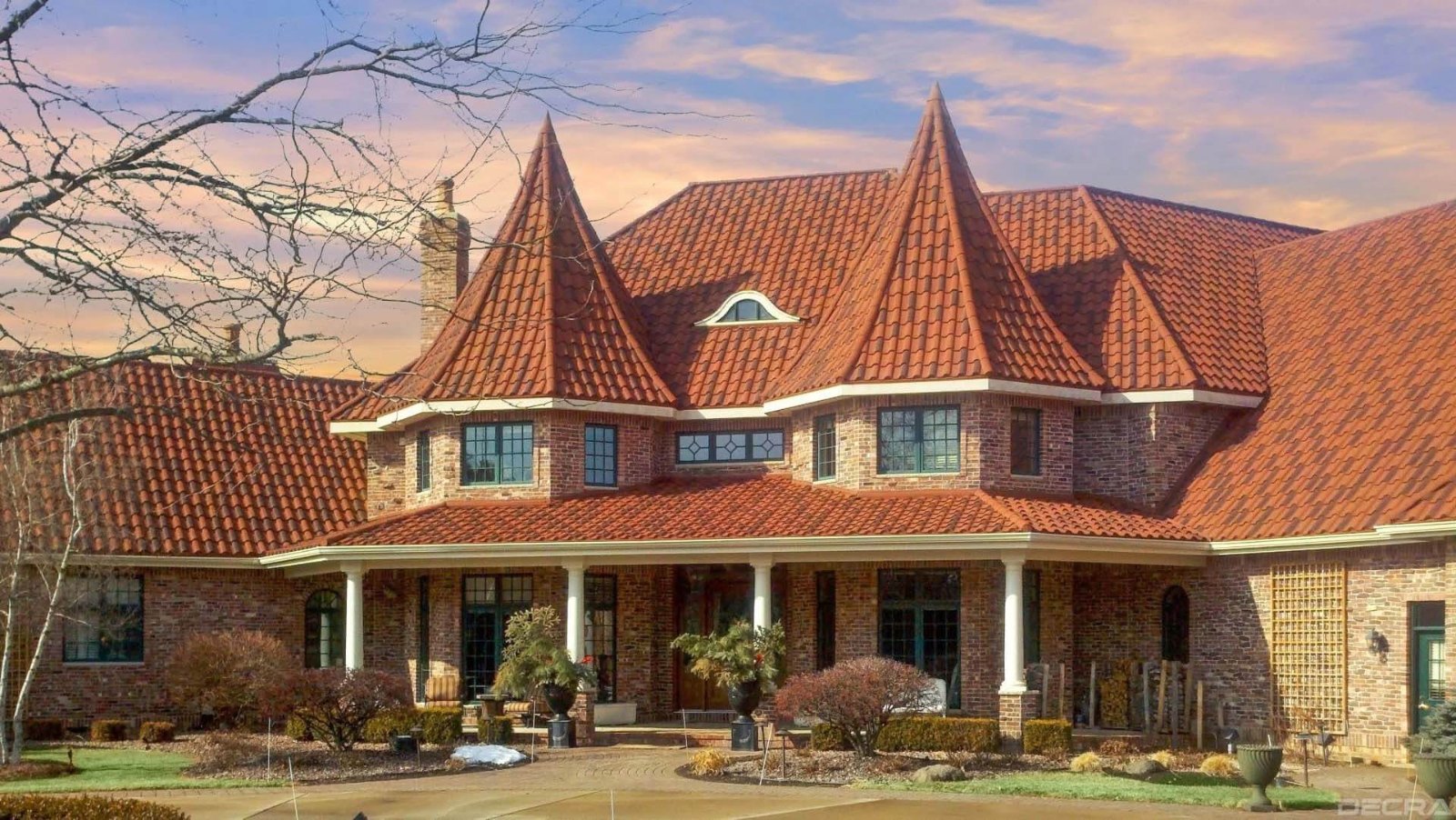 DECRA Villa Tile stone-coated steel roof on a home with a turret