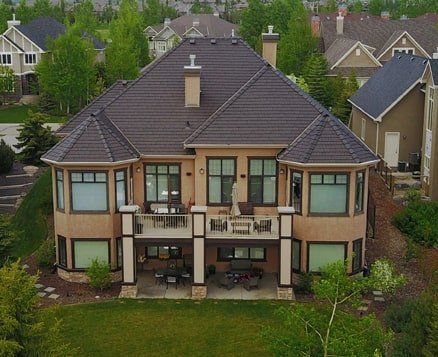 Euroshield Beaumont Shake recycled rubber roof on a two-storey brick home