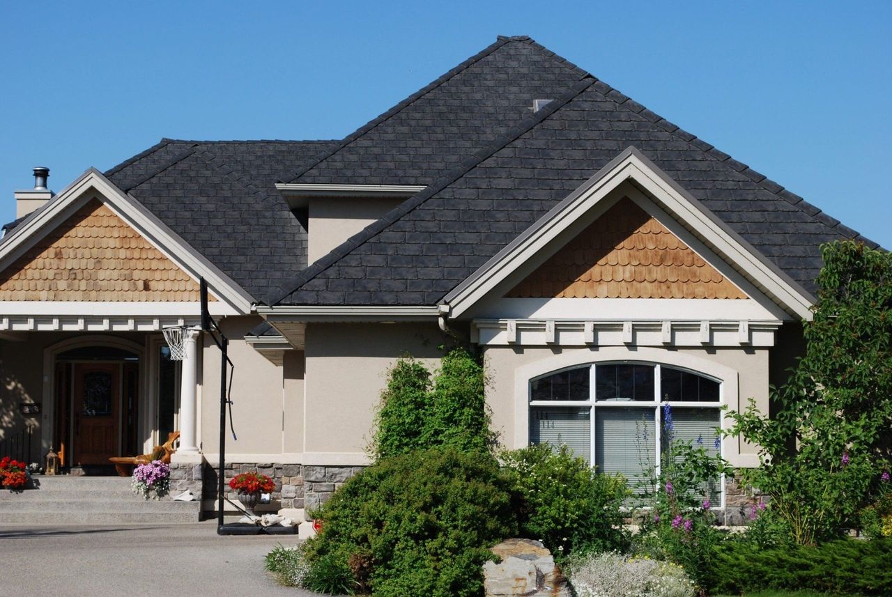 Euroshield Rundle Slate recycled rubber roof on a craftsman home with stone accents