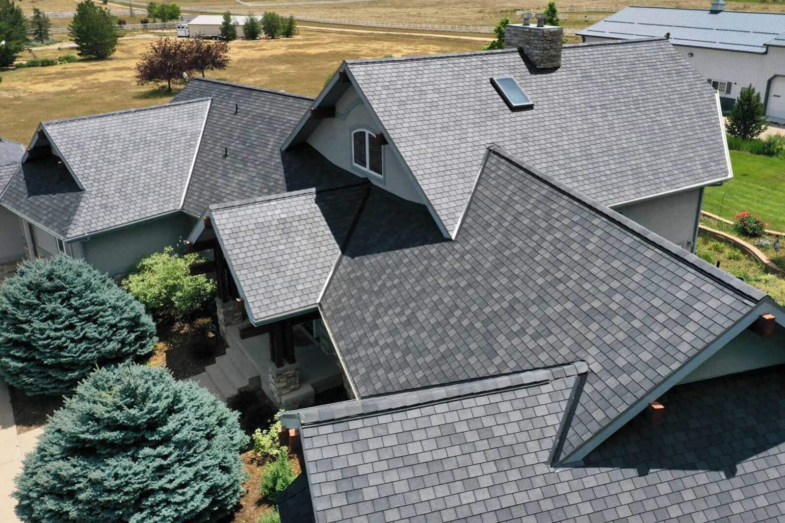 F-Wave REVIA Designer Slate American Blends in Charcoal Blend on a home with multiple gables