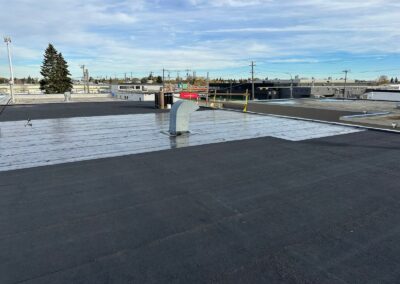 Flat roofing project by Iron Shield Roofing