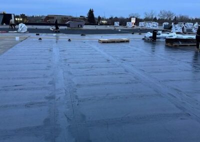 Flat roofing project by Iron Shield Roofing