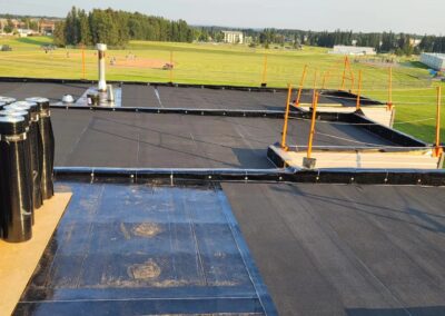 Flat roofing project by Iron Shield Roofing