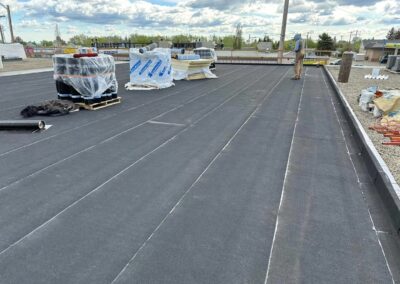 Flat roofing project by Iron Shield Roofing