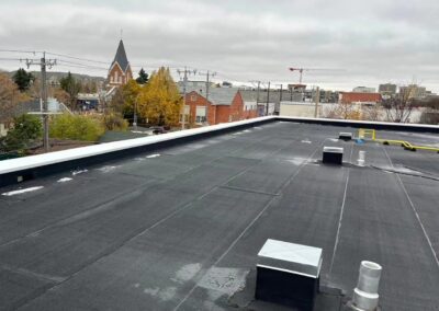 Flat roofing project by Iron Shield Roofing