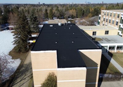 Flat roofing project by Iron Shield Roofing