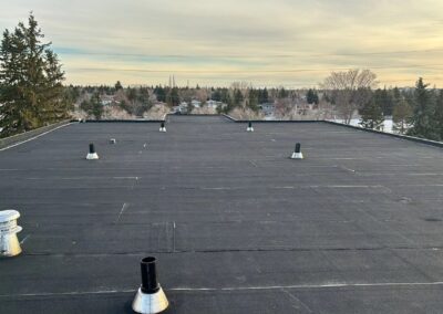 Flat roofing project by Iron Shield Roofing