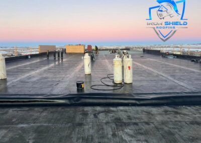 Flat roofing project by Iron Shield Roofing