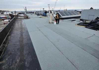 Flat roofing project by Iron Shield Roofing