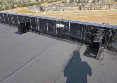 Flat roofing project by Iron Shield Roofing