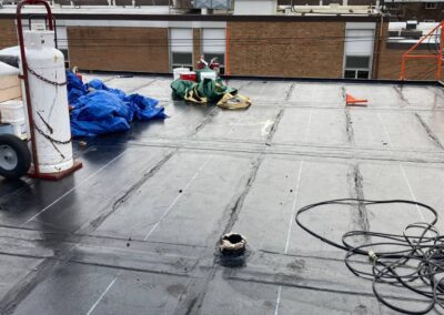 Flat roofing project by Iron Shield Roofing