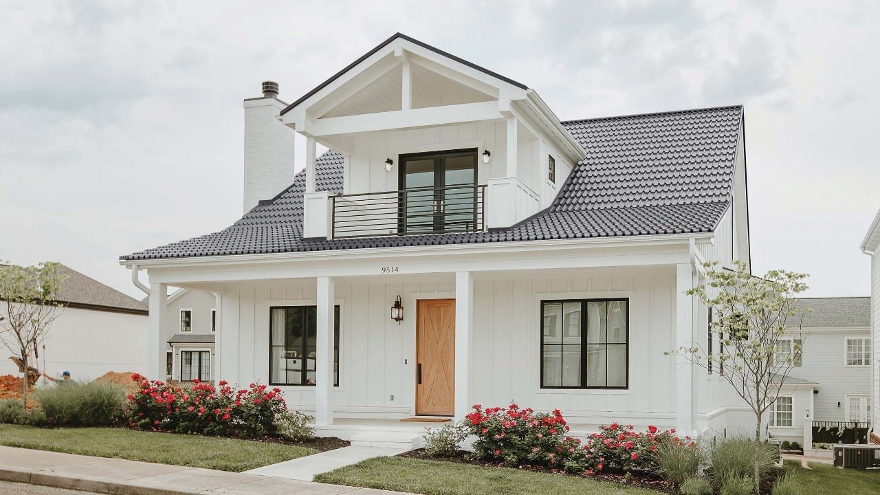 Vicwest True Nature Coastal Wave steel roof on a two-storey white home